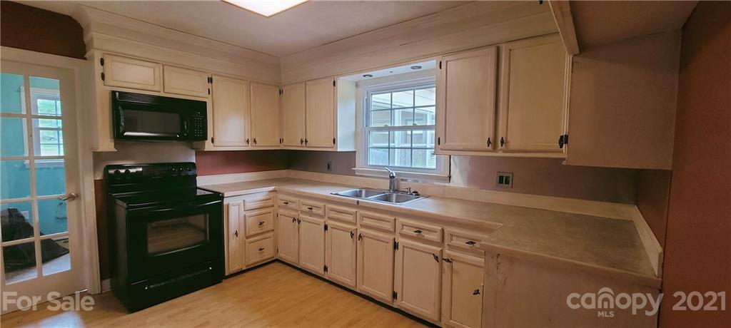 350 Rucker Road Rutherfordton, NC 28139 - Photo 11 of 13 a kitchen with a sink stove and cabinets