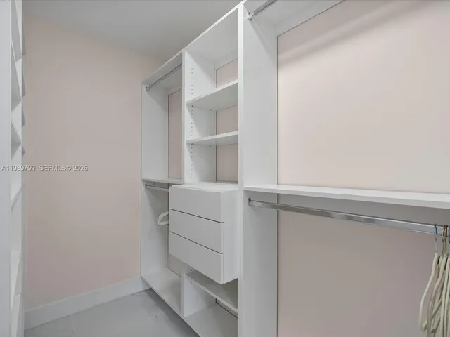 a view of an empty walk in closet