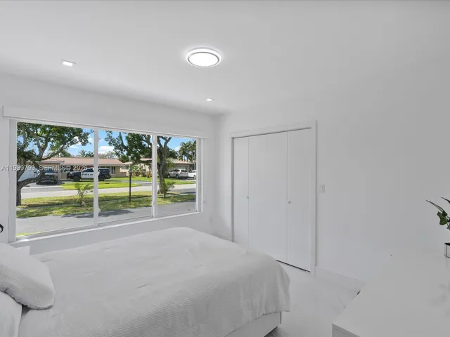 a view of a room with wooden floor and outer view