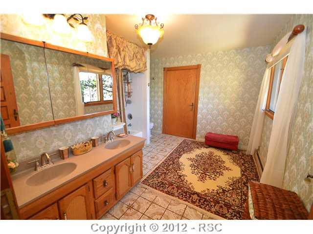 11685 Howells Road Colorado Springs, CO 80908 - Photo 8 of 16 THREE OF FIVE FULL BATHS ARE ON THE UPPER LEVEL.