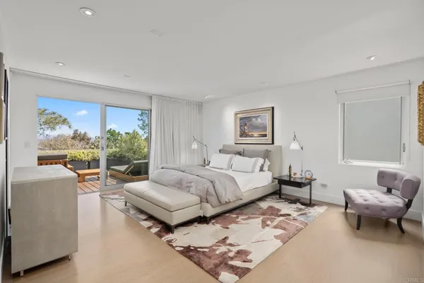 a bedroom with a bed and a couch