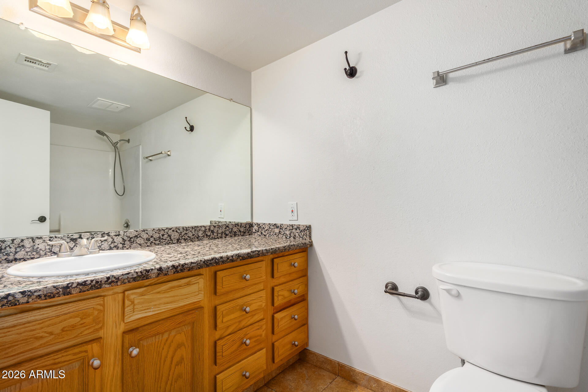 1885 East Alameda Drive Tempe, AZ 85282 - Photo 17 of 34 a bathroom with a granite countertop sink toilet and shower