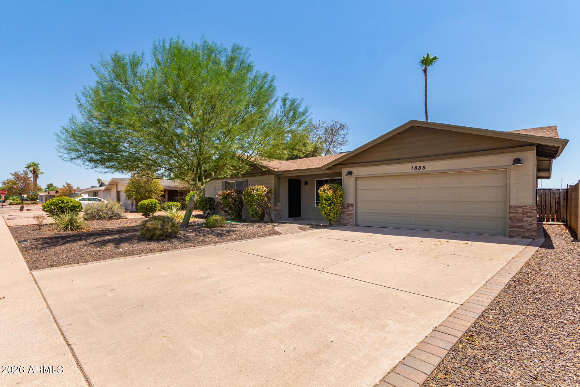 1885 East Alameda Drive Tempe, AZ 85282 - Photo 2 of 34 a front view of a house with a yard
