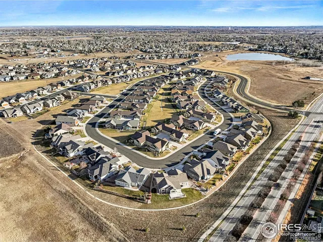 an aerial view of a residential building and an ocean view