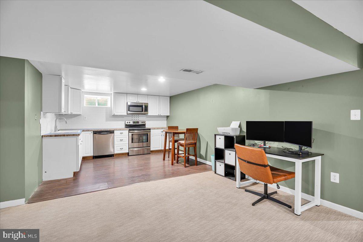 64 Blue Anchor Road Sicklerville, NJ 08081 - Photo 20 of 47 a workspace with furniture and kitchen view