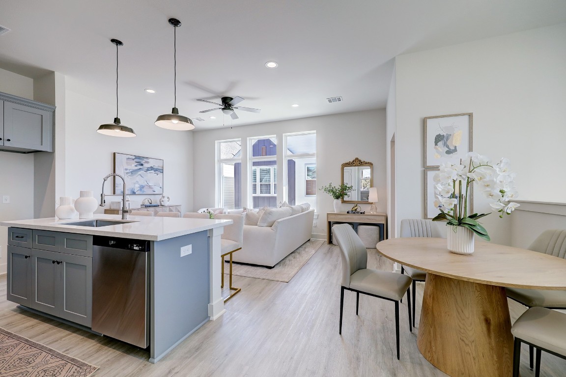 5242 Texas Street Houston, TX 77011 - Photo 11 of 27 a view of a kitchen area with furniture and wooden floor