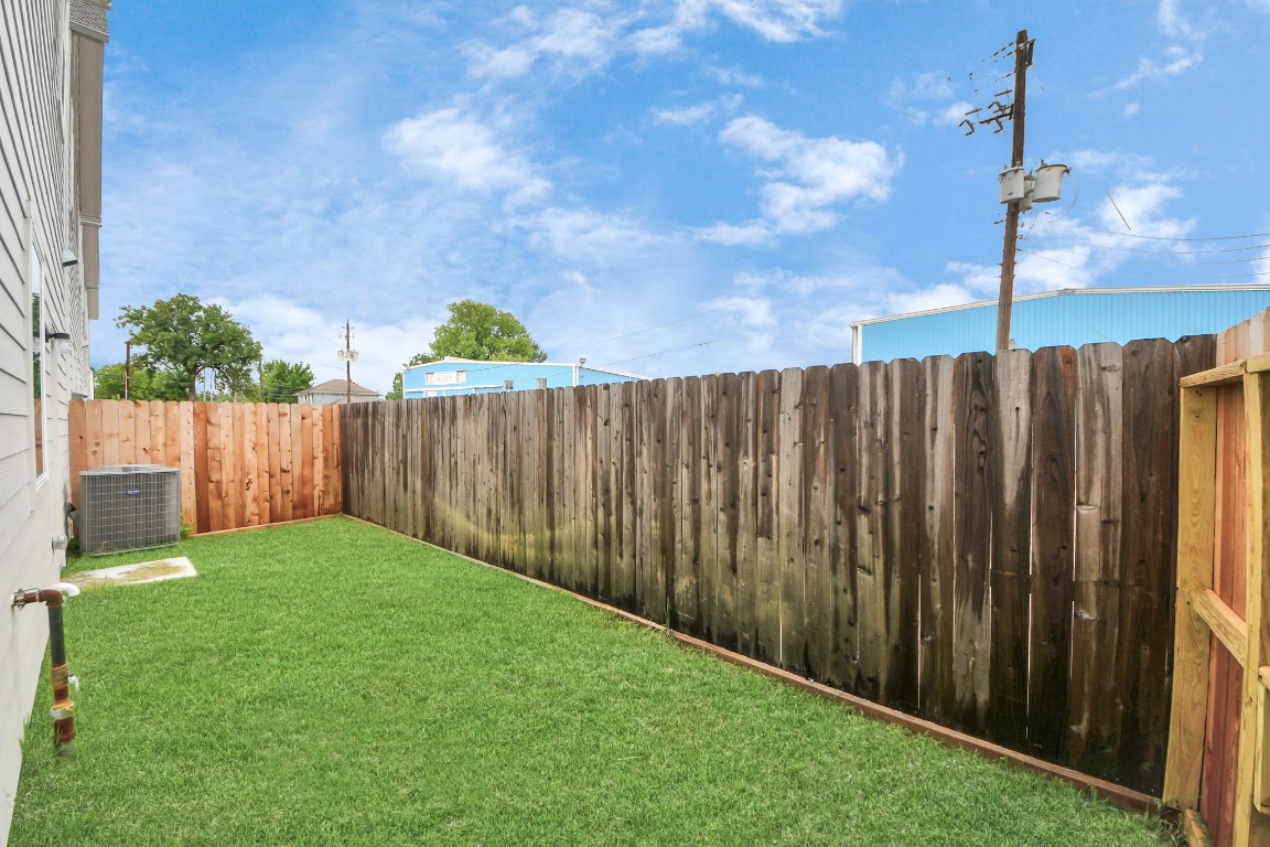 5242 Texas Street Houston, TX 77011 - Photo 25 of 27 a view of backyard with wooden fence