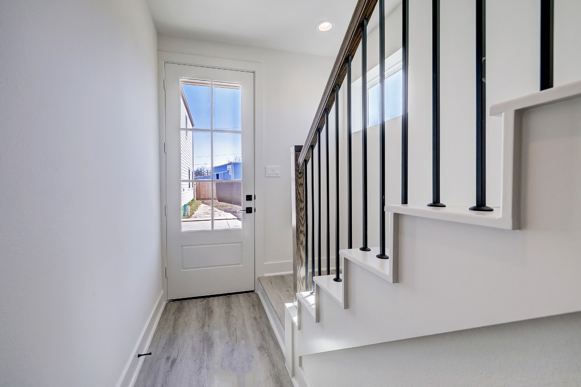 5242 Texas Street Houston, TX 77011 - Photo 5 of 27 a view of a hallway with wooden floor and entryway