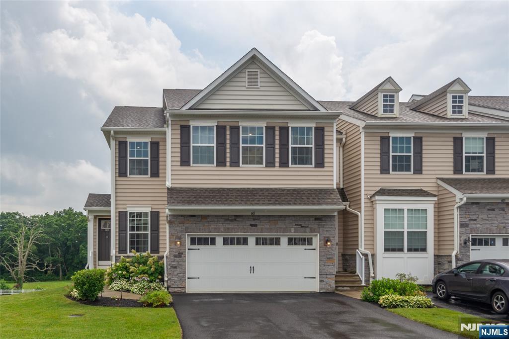 601 Charleston Drive, Unit 601 Monroe Township, NJ 08831 - Photo 1 of 45 a front view of a house with a yard