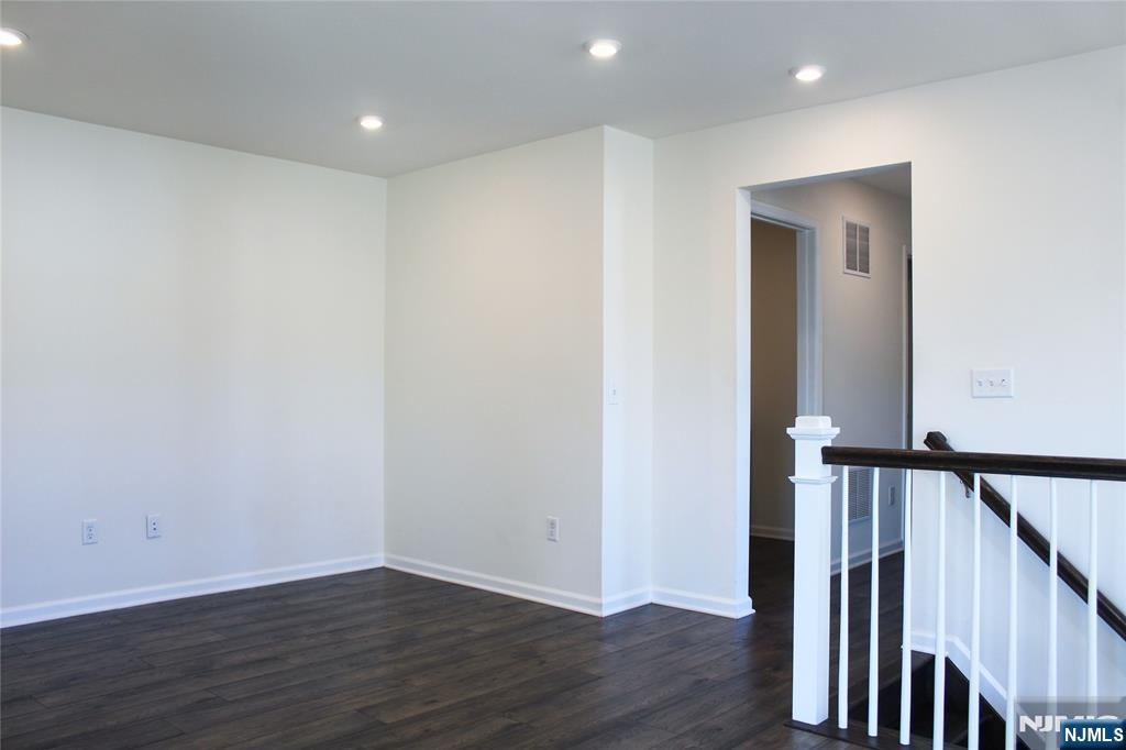 601 Charleston Drive, Unit 601 Monroe Township, NJ 08831 - Photo 18 of 45 a view of a hallway with wooden floor