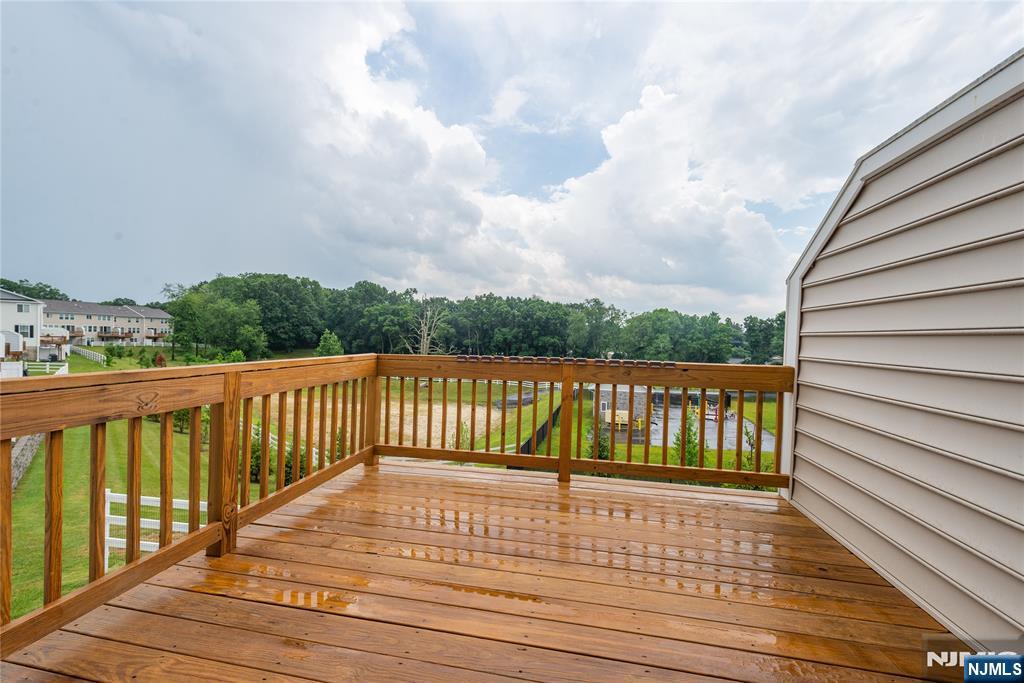 601 Charleston Drive, Unit 601 Monroe Township, NJ 08831 - Photo 42 of 45 a view of balcony with wooden floor