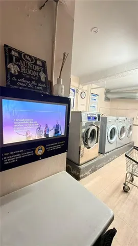 a hallway with a washer and dryer