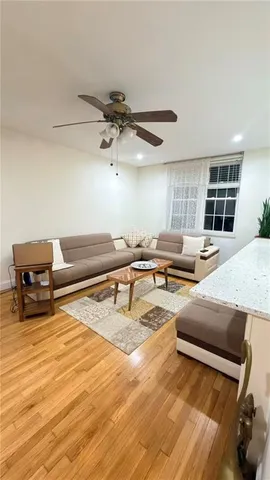 a large white kitchen with cabinets