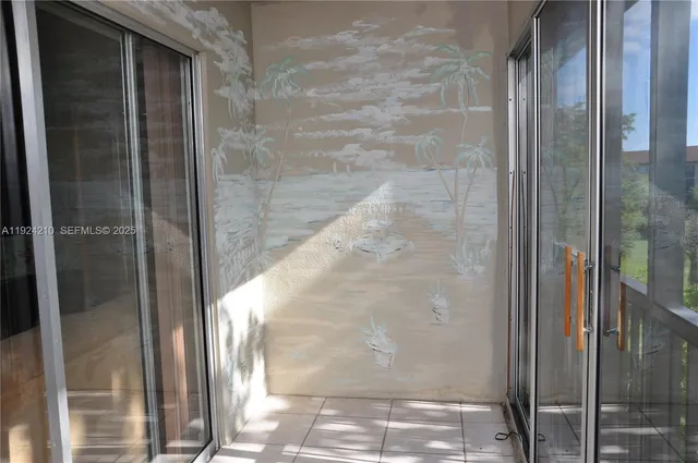 a view of a bathroom from a glass door