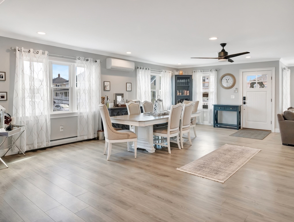 47 B Street, Unit BEACHSIDE Hull, MA 02045 - Photo 15 of 42 a view of a dining room with furniture window and wooden floor