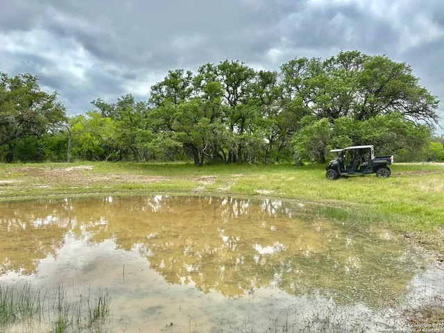 a view of a lake with a yard