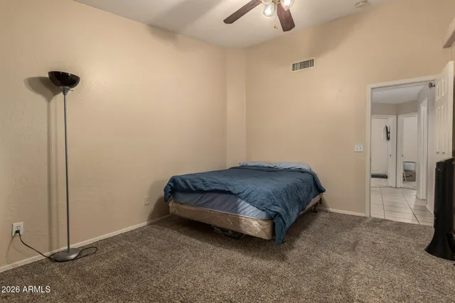 a room with a bed and a chandelier