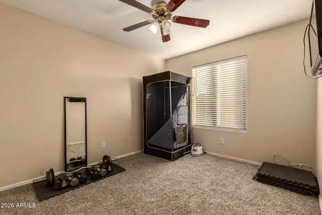 a room with gym equipment and a large window