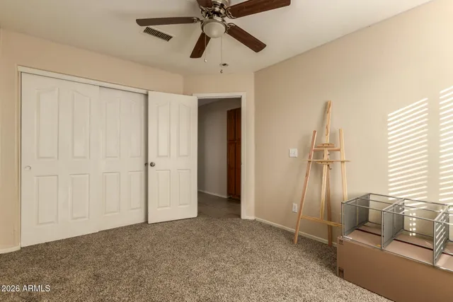 a view of livingroom with hardwood floor and ceiling fan