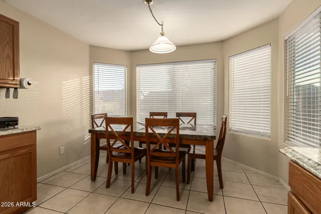 a view of a dining room with furniture and windows