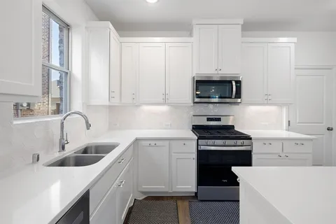 a bathroom with a sink and mirror