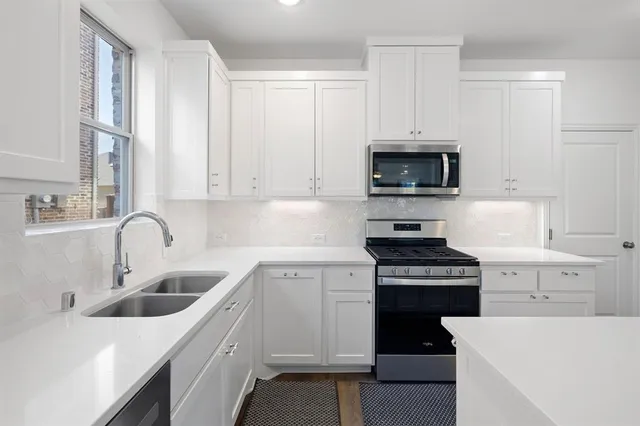 a bathroom with a sink and mirror
