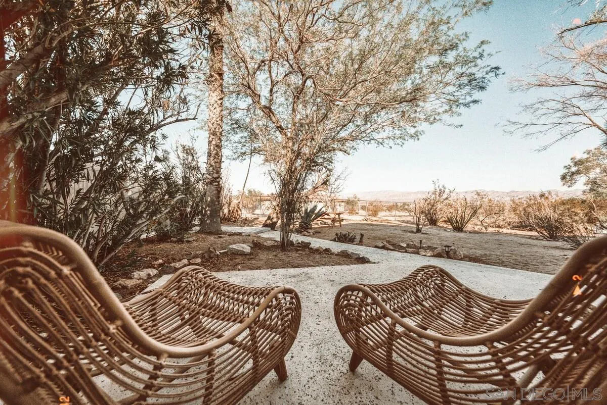 3900 Ave Tortuga Joshua Tree, CA 92252 - Photo 26 of 28 a view of a swimming pool with lounge chairs