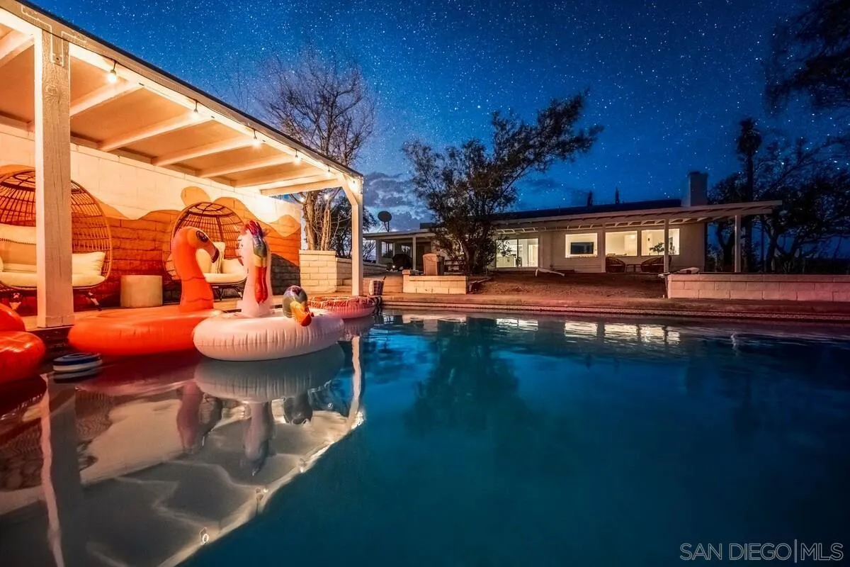 3900 Ave Tortuga Joshua Tree, CA 92252 - Photo 3 of 28 a view of a swimming pool with an outdoor seating