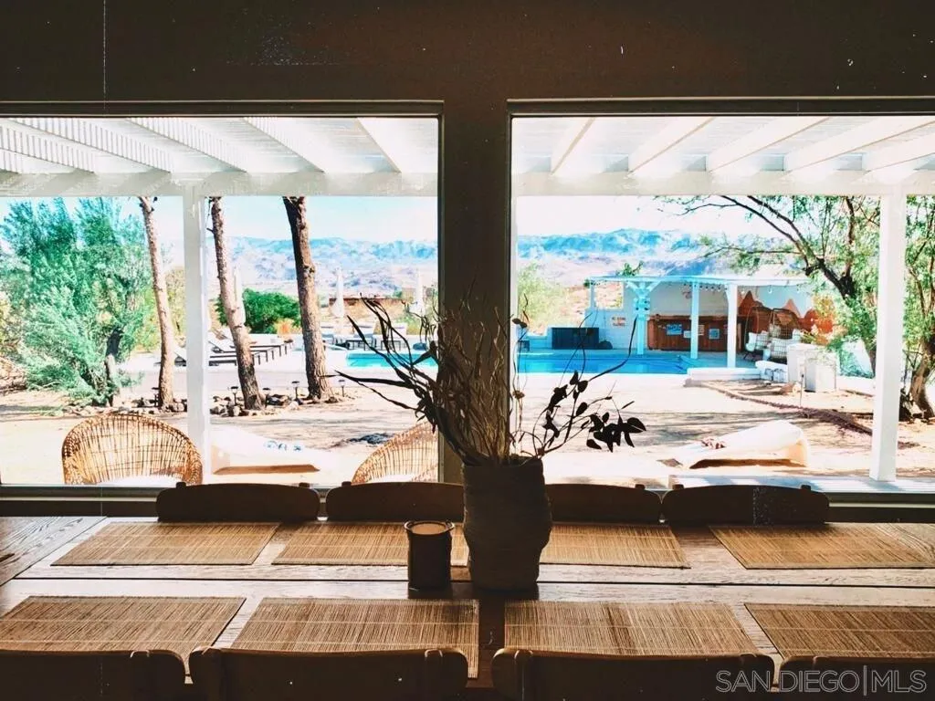 3900 Ave Tortuga Joshua Tree, CA 92252 - Photo 5 of 28 a view of swimming pool from a living room