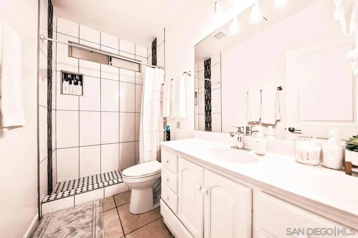 3900 Ave Tortuga Joshua Tree, CA 92252 - Photo 6 of 28 a bathroom with a sink a toilet and shower