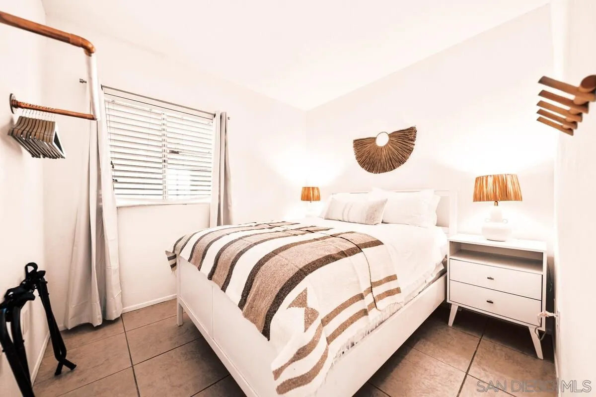 3900 Ave Tortuga Joshua Tree, CA 92252 - Photo 10 of 28 a bedroom with a bed and a window