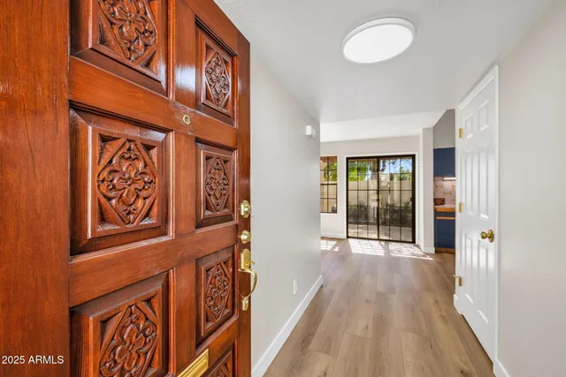 a view of a brick wall with a street