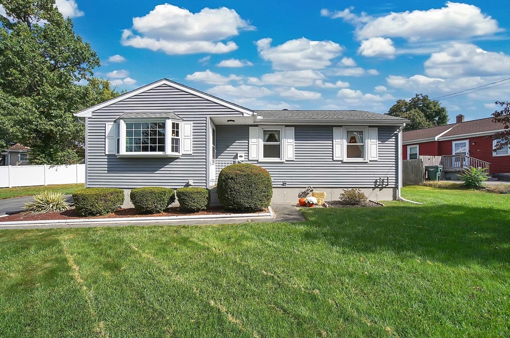 92 Agnes Street Springfield, MA 01118 - Photo 1 of 29 a front view of a house with a yard