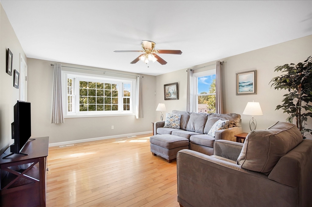 92 Agnes Street Springfield, MA 01118 - Photo 5 of 29 a living room with furniture a flat screen tv and a window