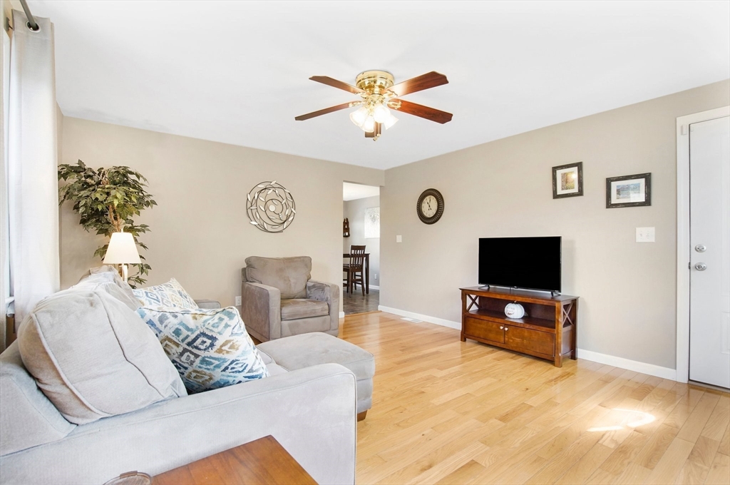 92 Agnes Street Springfield, MA 01118 - Photo 6 of 29 a living room with furniture a flat screen tv and a window