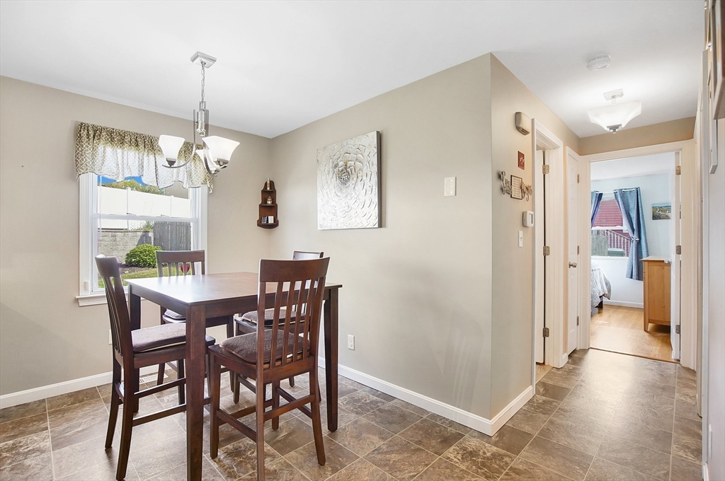 92 Agnes Street Springfield, MA 01118 - Photo 8 of 29 a view of a dining room with furniture window and wooden floor