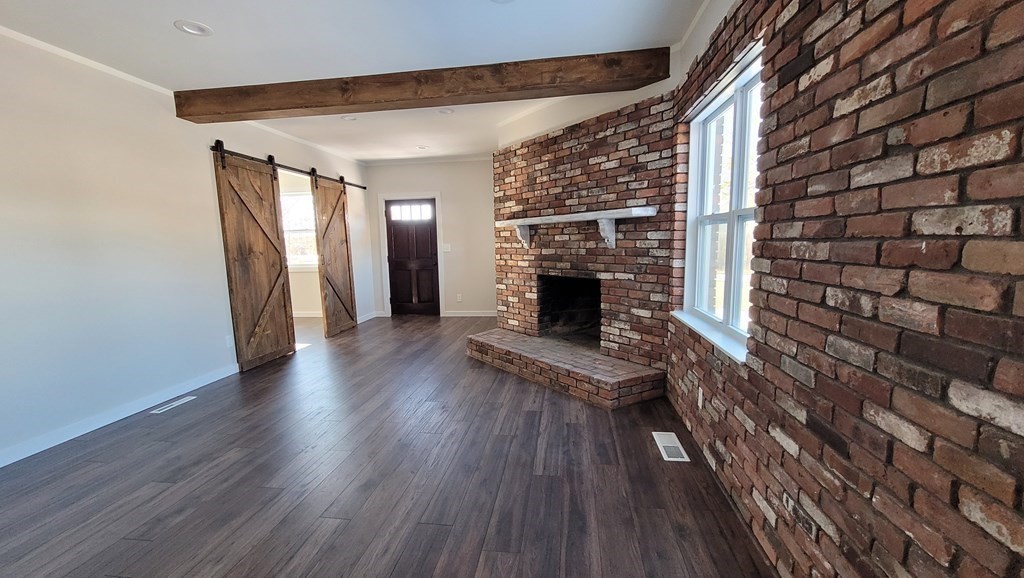 9 Belanger Road Southampton, MA 01073 - Photo 13 of 19 a view of empty room with wooden floor and fireplace