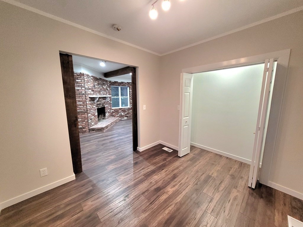 9 Belanger Road Southampton, MA 01073 - Photo 15 of 19 an empty room with wooden floor and a fireplace