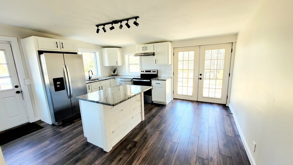 9 Belanger Road Southampton, MA 01073 - Photo 6 of 19 a kitchen with a refrigerator a sink dishwasher and wooden cabinets
