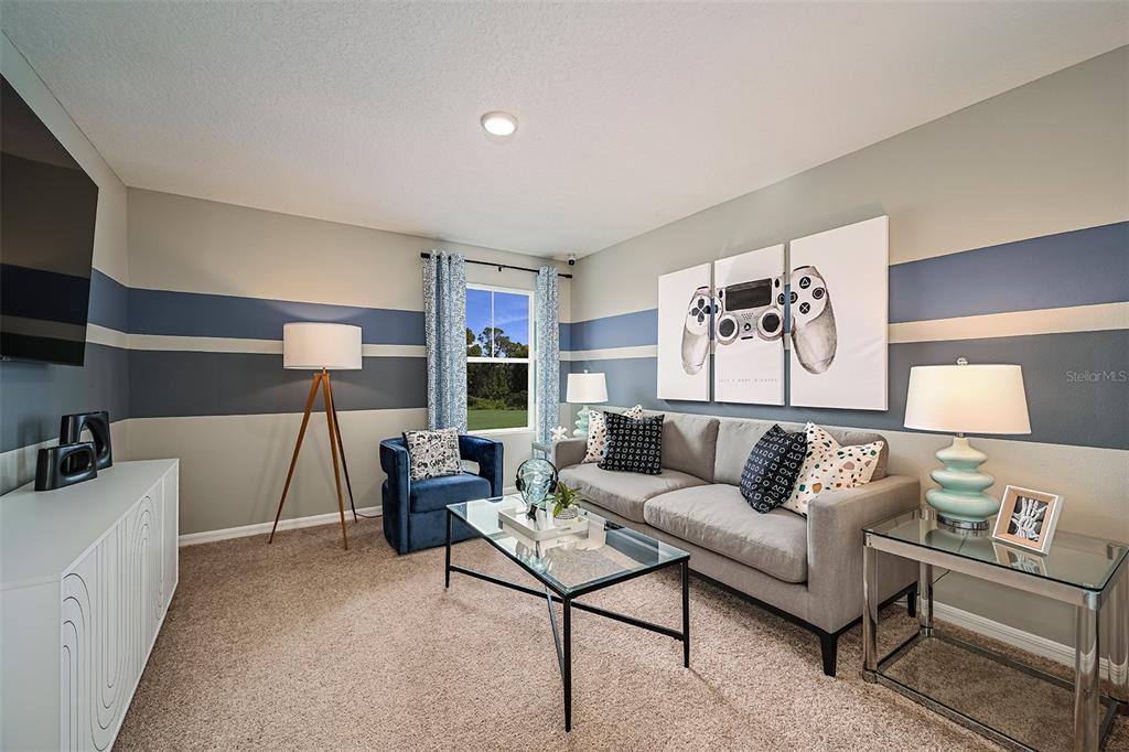 1334 Palmeroy Road Haines City, FL 33844 - Photo 11 of 22 a living room with furniture and a flat screen tv