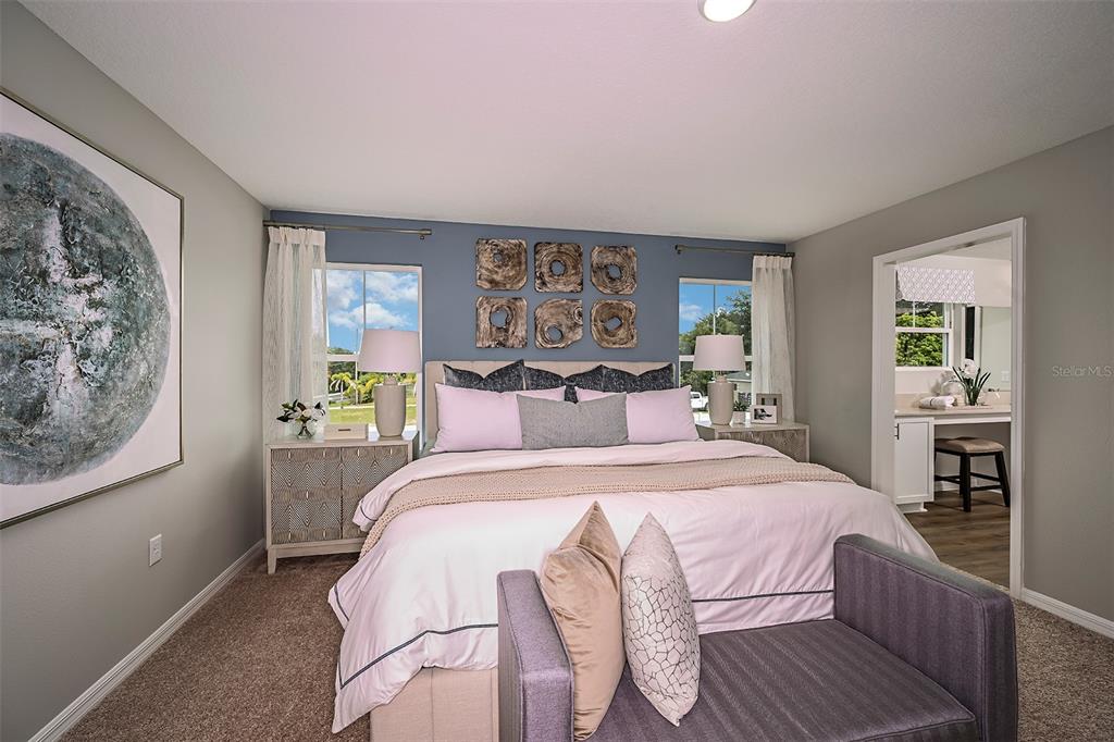 1334 Palmeroy Road Haines City, FL 33844 - Photo 13 of 22 a bedroom with a large bed and a window