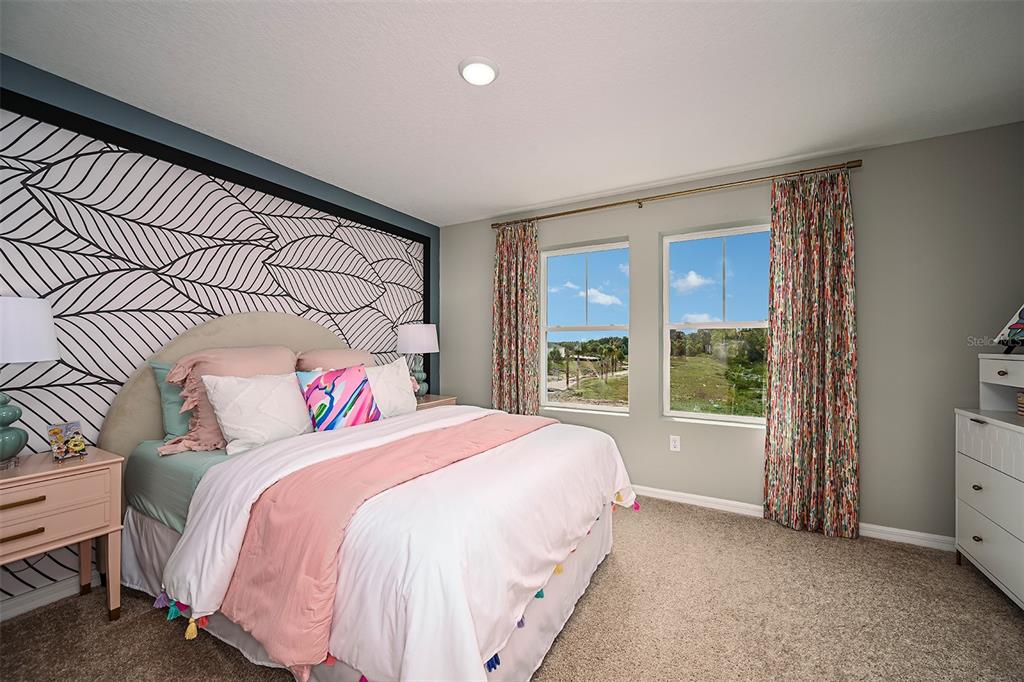 1334 Palmeroy Road Haines City, FL 33844 - Photo 17 of 22 a bedroom with a bed and a large window