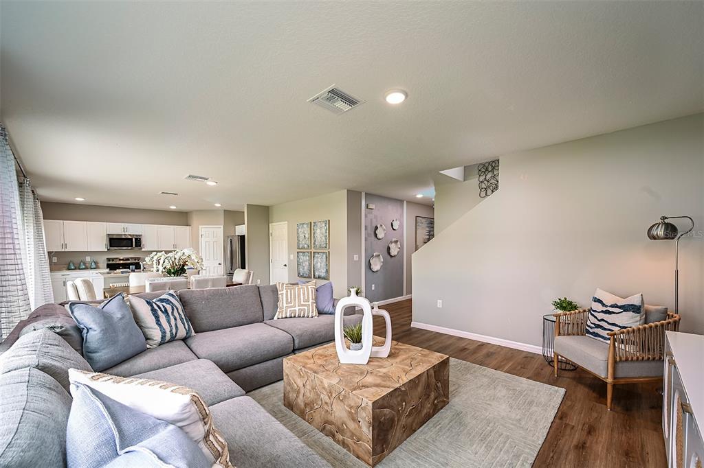 1334 Palmeroy Road Haines City, FL 33844 - Photo 6 of 22 a living room with furniture and wooden floor
