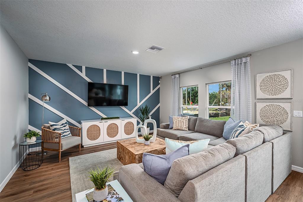 1334 Palmeroy Road Haines City, FL 33844 - Photo 8 of 22 a living room with furniture and a window