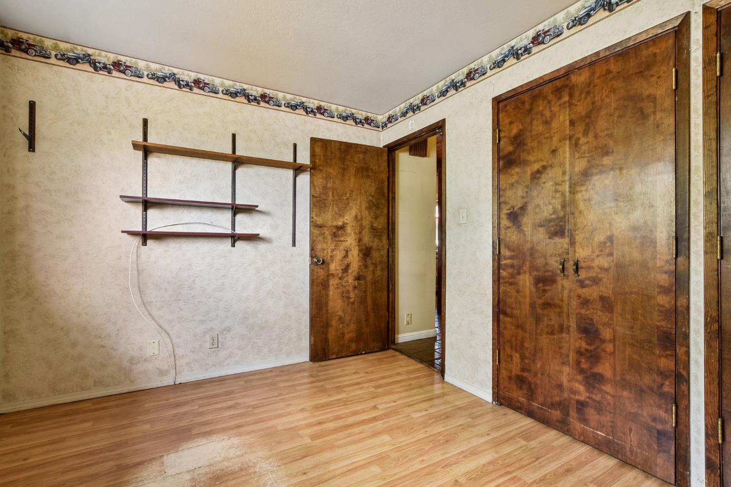 6180 Rustic Hills Drive Rocklin, CA 95677 - Photo 12 of 37 a view of a room with wooden floor and windows