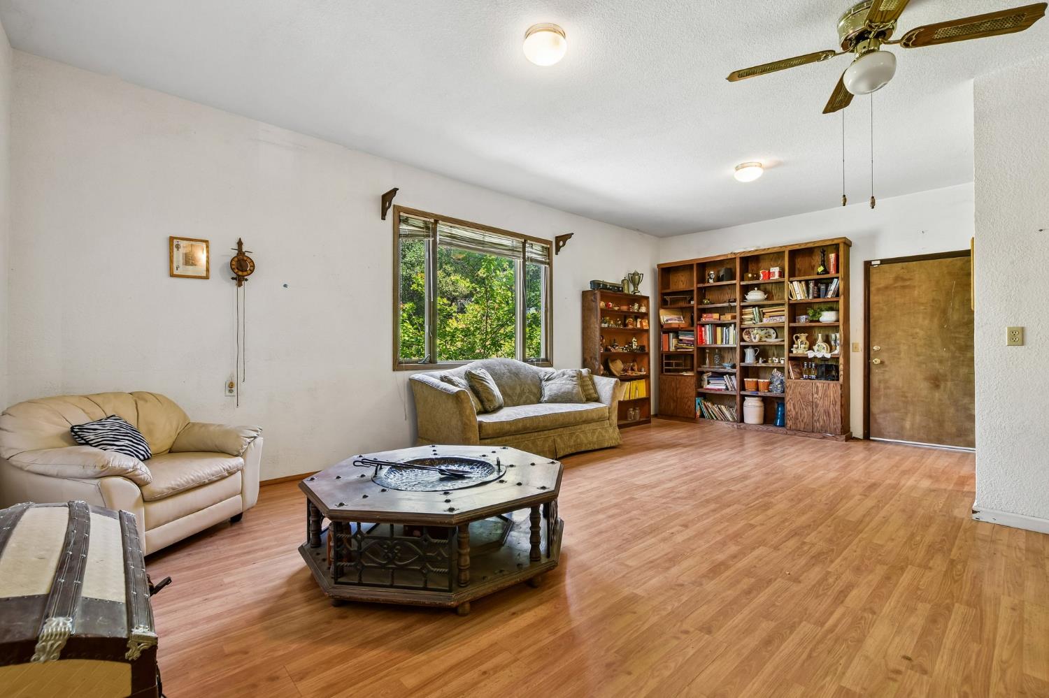 6180 Rustic Hills Drive Rocklin, CA 95677 - Photo 15 of 37 a living room with furniture and a wooden floor
