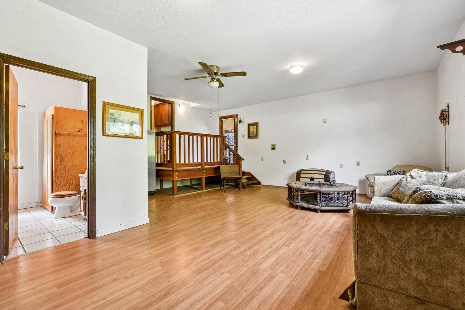6180 Rustic Hills Drive Rocklin, CA 95677 - Photo 16 of 37 a living room with furniture and a wooden floor