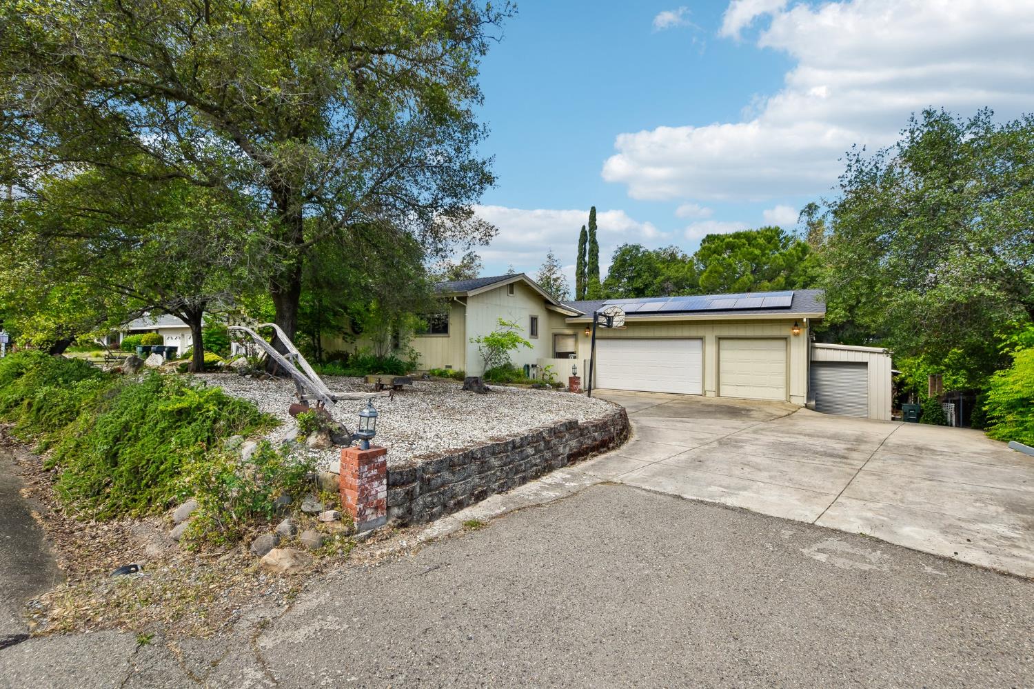 6180 Rustic Hills Drive Rocklin, CA 95677 - Photo 2 of 37 a view of a house with a yard and large tree