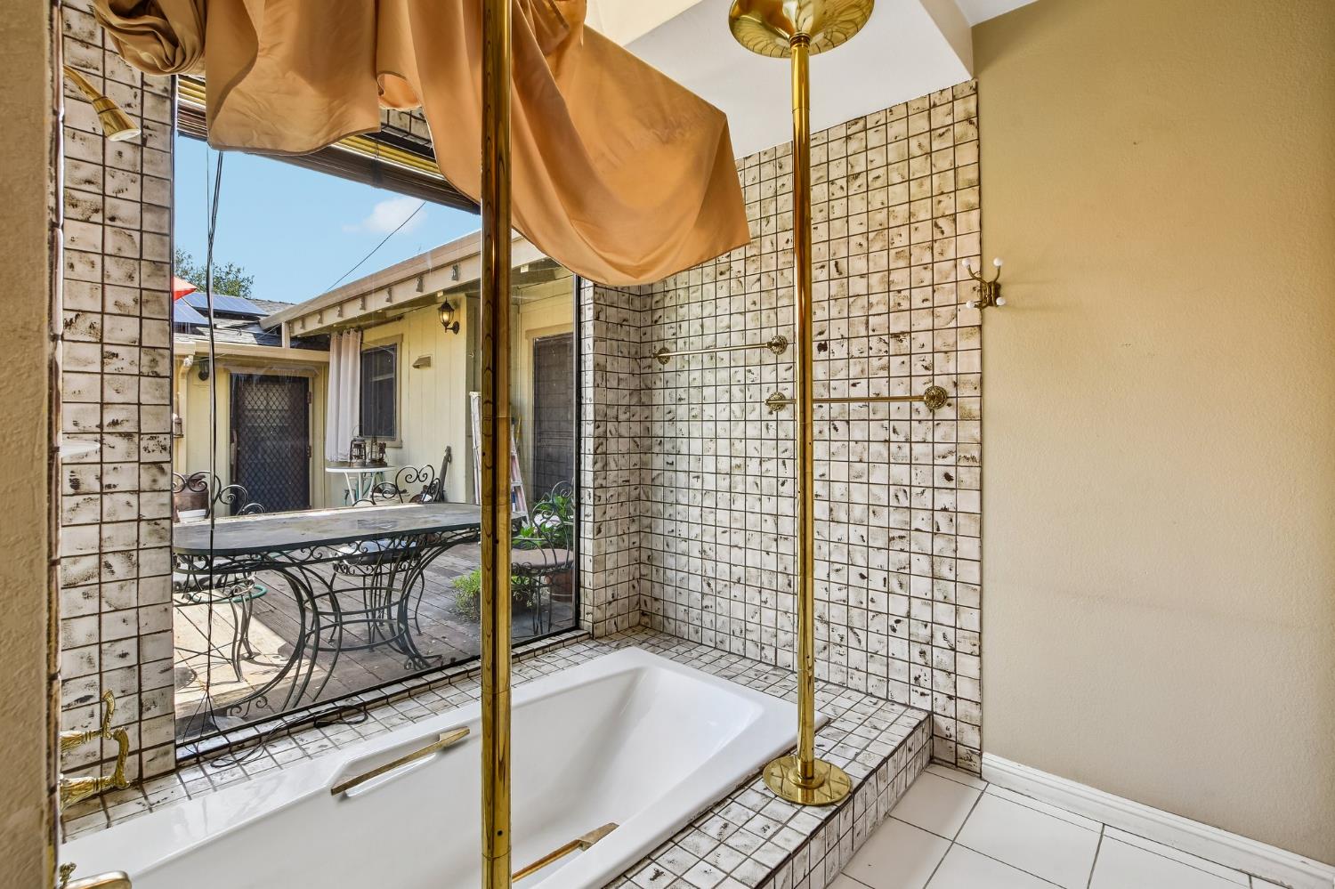 6180 Rustic Hills Drive Rocklin, CA 95677 - Photo 22 of 37 a picture of a bathroom with a sink and a shower
