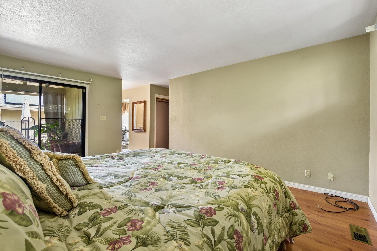 6180 Rustic Hills Drive Rocklin, CA 95677 - Photo 24 of 37 a bedroom with a bed and dresser